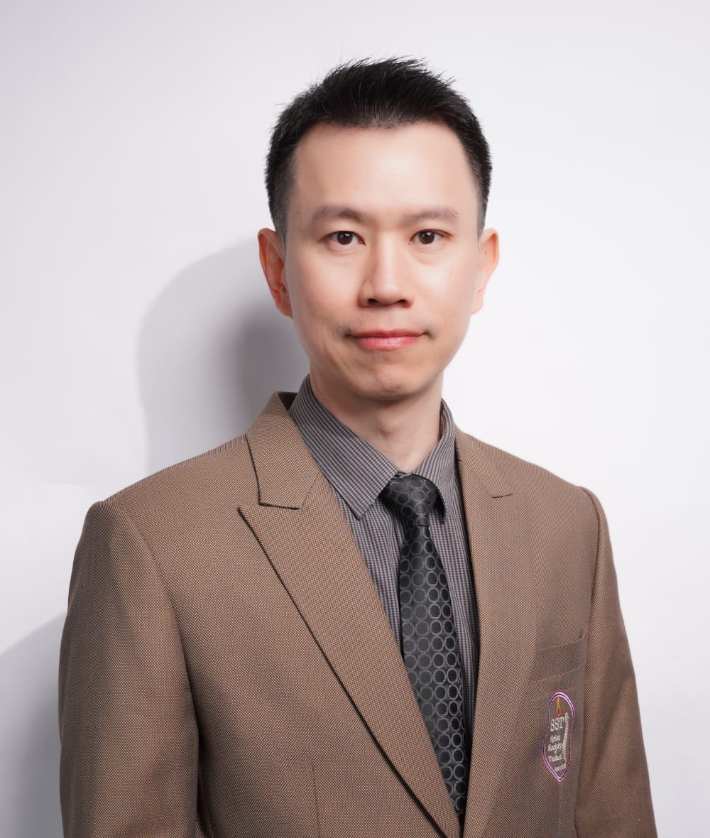 กระดูกสันหลัง กรรมการบริหารปัจจุบัน สวมสูทสีน้ำตาลอ่อน ออร์โธปิดิกส์